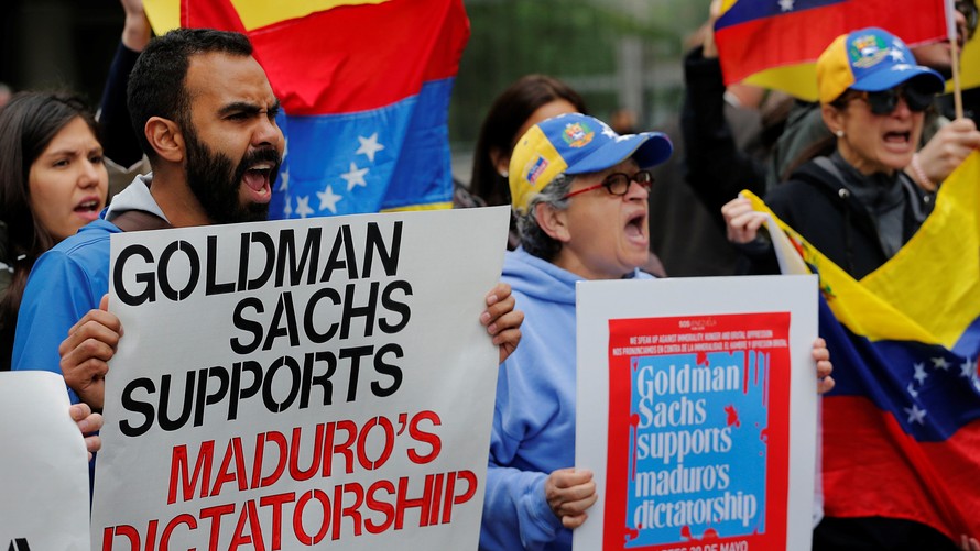 Reuters     
       Protesters demonstrate outside of Goldman Sachs headquarters after the company purchased Venezuelan bonds