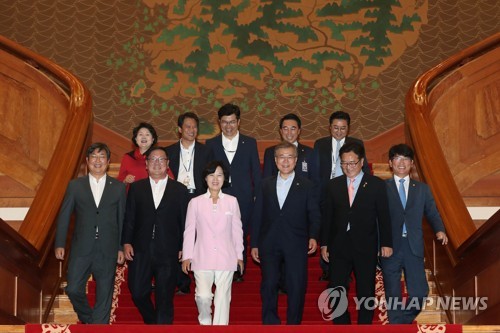 President Moon Jae-in and leaders of the ruling Democratic Party including party chairwoman Rep. Choo Mi-ae, head toward the exit of the presidential office Cheong Wa Dae following a dinner hosted by the