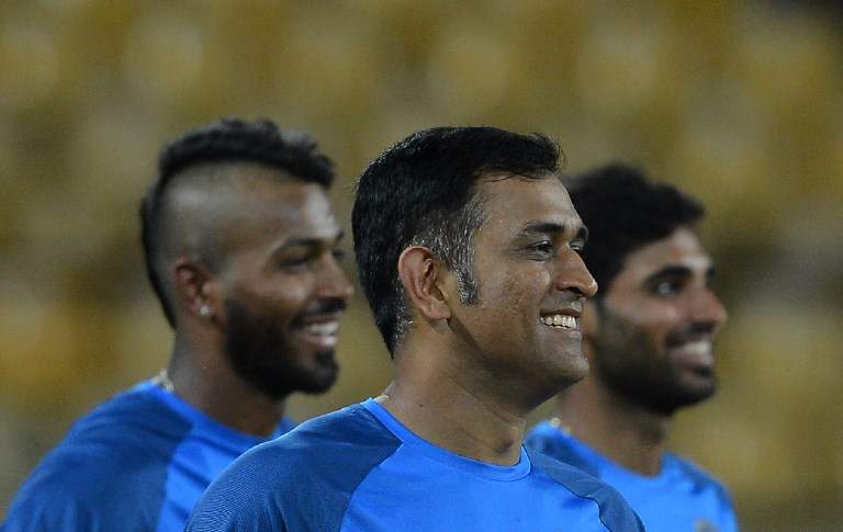 Indian cricketer Mahendra Singh Dhoni, Bhuvneshwar Kumar and Hardik Pandya look on during a practice session at The