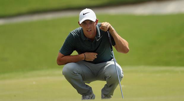 CHARLOTTE NC- AUGUST 12 Rory Mc Ilroy of Northern Ireland lines up a putt on the first green during the third round of the 2017 PGA Championship at Quail Hollow Club