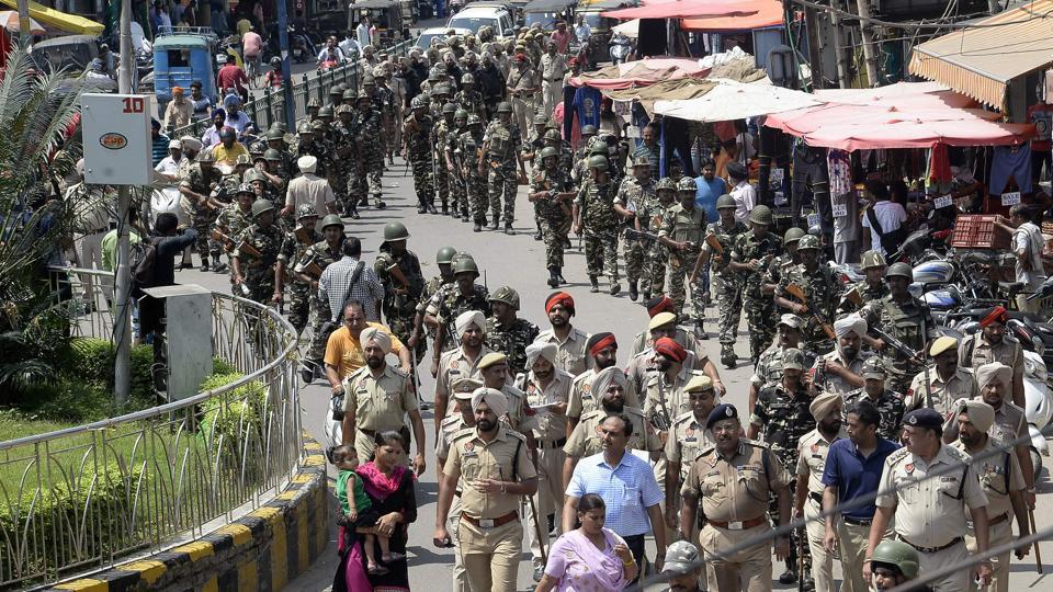 Paramiltary forces and police march in Jalandhar on August 26. Security in Haryana and Punjab has been beefed up after followers of controversial guru Ram Rahim Singh on August 25 went on a rampage after their spiritual leader was convicted of rape