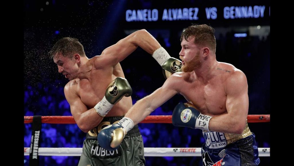 Canelo Alvarez right fights Gennady Golovkin during a middleweight title fight Sunday Sept. 17 2017 in Las Vegas