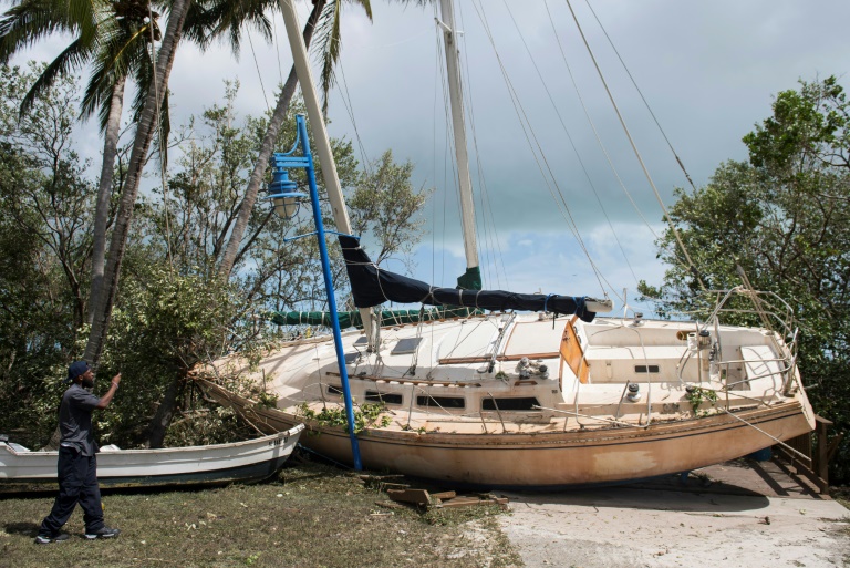 A boat sits in a park after being beached by storm surge from Hurricane Irma in Coconut Grove Florida