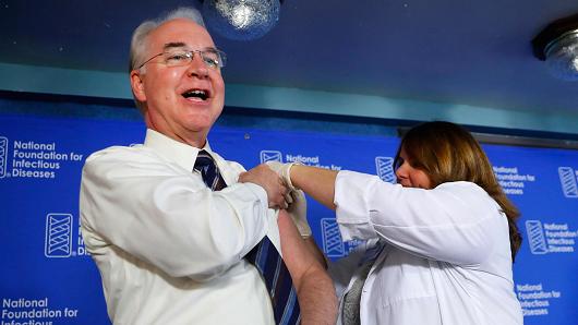 Health and Human Services Secretary Tom Price left receives a flu vaccination from Sharon Walsh-Bonadies RN. right during a news conference recommending everyone age six months an older be vaccinated against influenza each year Thursday Sept. 28 2