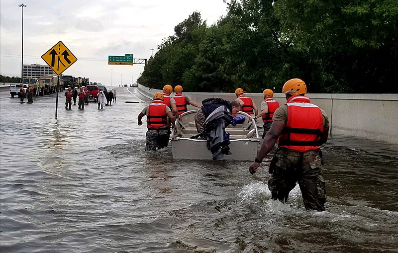 Rescuers at work in the flood image via Wikimedia Commons