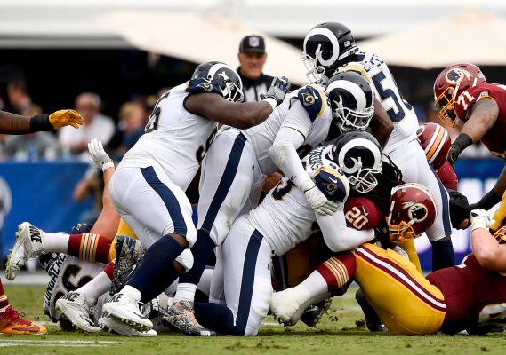 The Los Angeles Rams defense makes a tackle