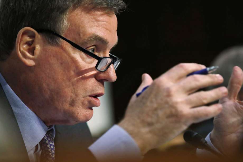 Senate Intelligence Committee Vice Chairman Sen. Mark Warner D-Va. asks questions during a committee hearing on Capitol Hill in Washington. Warner is writing a bill that would require social media compa