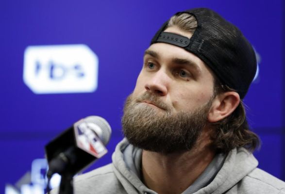 Washington Nationals right fielder Bryce Harper listens