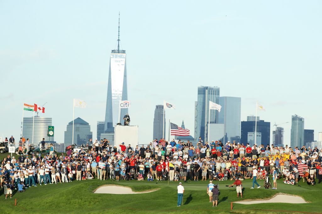 Marc Leishman plays a shot to the 18th green