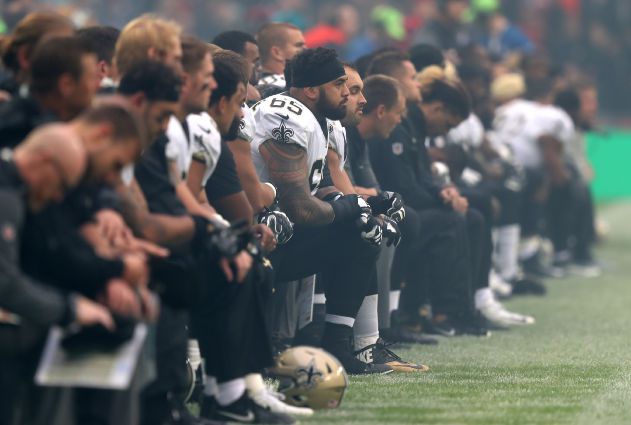 New Orleans Saints players kneel prior to the US anthem being played at Wembley