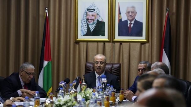 Palestinian Prime Minister Rami Hamdallah chairs a reconciliation government cabinet meeting in Gaza on Tuesday