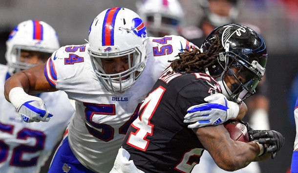 Oct 1 2017 Atlanta GA USA Atlanta Falcons running back Devonta Freeman is tackled by Buffalo Bills linebacker Eddie Yarbrough during the fourth quarter at Mercedes Benz Stadium