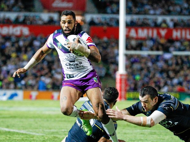 Joshua Addo Carr of the Storm looks for a gap in the Cowboys defence during the Round 22 NRL match between the North Queensland Cowboys and the Melbourne Storm at 1300SMILES Stadium in Townsville Friday