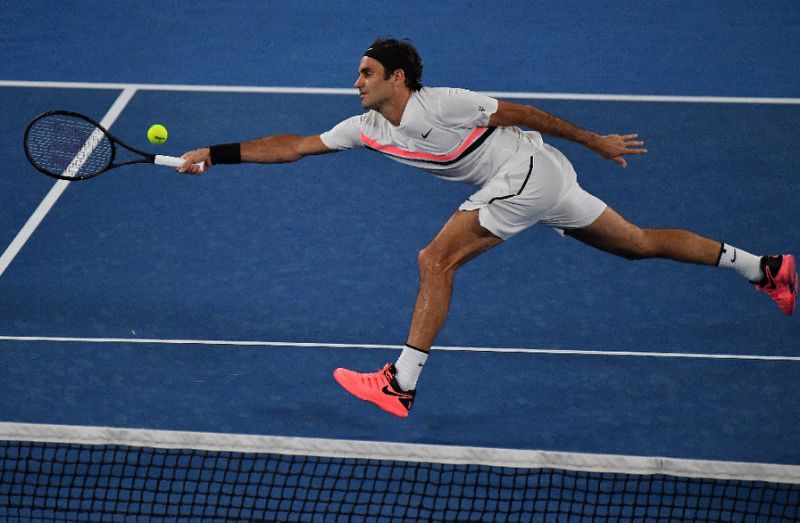 Switzerland's Roger Federer plays a forehand return to Germany's Jan Lennard Struff during their men's singles second round match on day four of the Australian Open tennis tournament in Melbourne