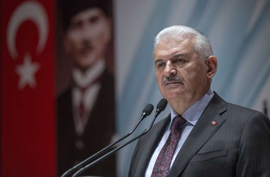 Turkey's Prime Minister Binali Yildirim speak to the country's security chiefs in Ankara Turkey Thursday Jan. 18 2018. Yildirim on Thursday complained about inconsistent statements from the United States concerning the creation of a border secruty for