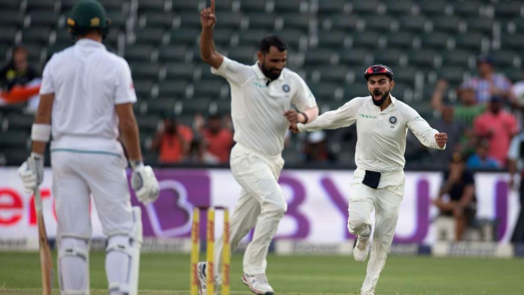 Virat Kohli celebrates with Mohammed Shami a fall of South African wicket