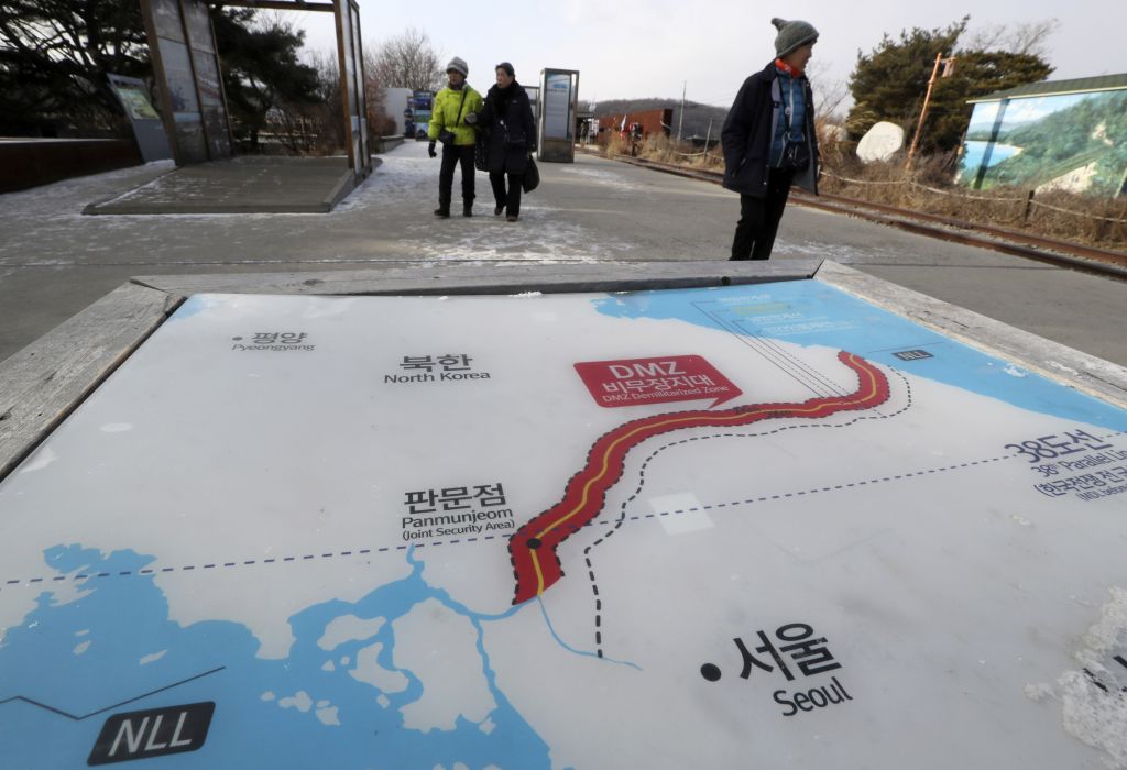 Visitors walk by a map of North and South Korea at the Imjingak Pavilion in Paju South Korea on Jan. 9. North Korea agreed Tuesday to send a delegation to next month's Winter Olympics in South Korea Seoul officials said as the bitter rivals sat for