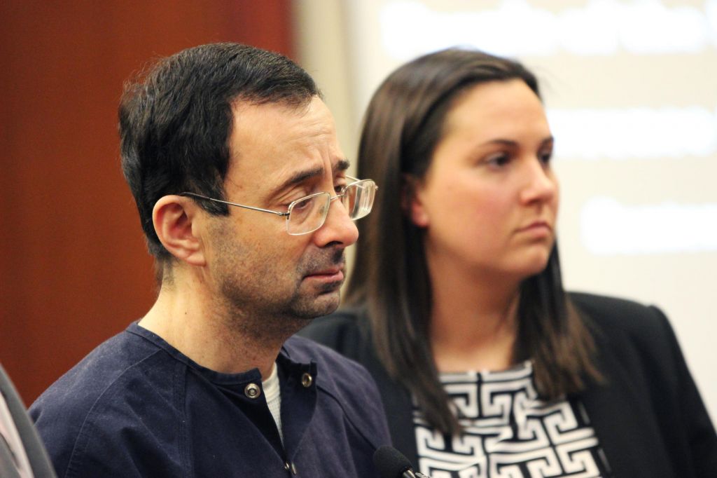 Larry Nassar listens to Ingham County Judge Rosemarie Aquilina hand down his sentence of 175 years in prison