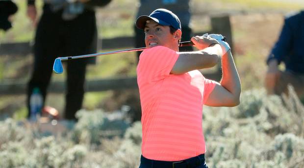 Contender Rory Mc Ilroy plays the fifth hole in last night’s opening round of the AT&T Pebble Beach Pro-Am