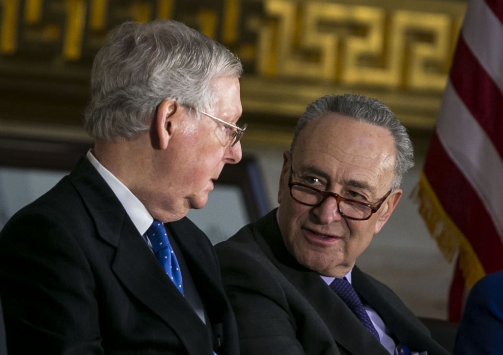 Senate Majority Leader Mitch Mc Connell  and Senate Minority Leader Chuck Schumer talk during the congressional Gold Medal ceremony for former Senate Majority Leader Bob Dole at the U.S. Capitol