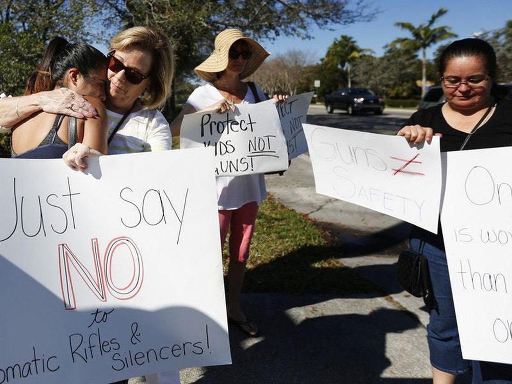 Protesters hold up anti-gun signs in Parkland Florida