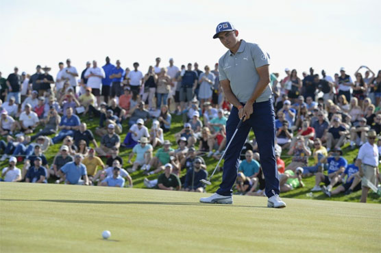 Rickie Fowler share the lead at the US PGA Tour Phoenix Open alongside Bryson DeChambeau