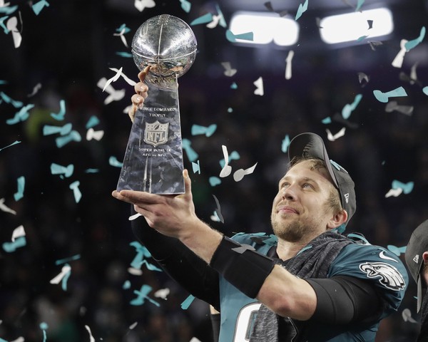 Philadelphia Eagles Nick Foles holds up the Vince Lombardi Trophy after the NFL Super Bowl 52 football game against the New England Patriots Sunday Feb. 4 2018 in Minneapolis. The Eagles won 41-33