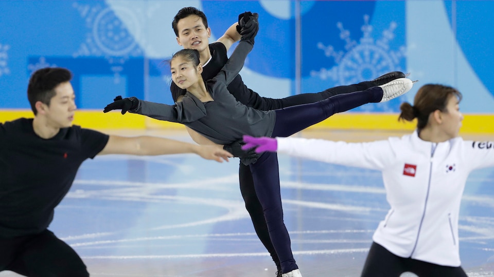 North and South Korean pairs teams practice