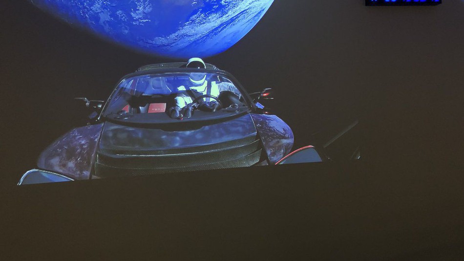 The Tesla Roadster orbits Earth before blasting off further into space