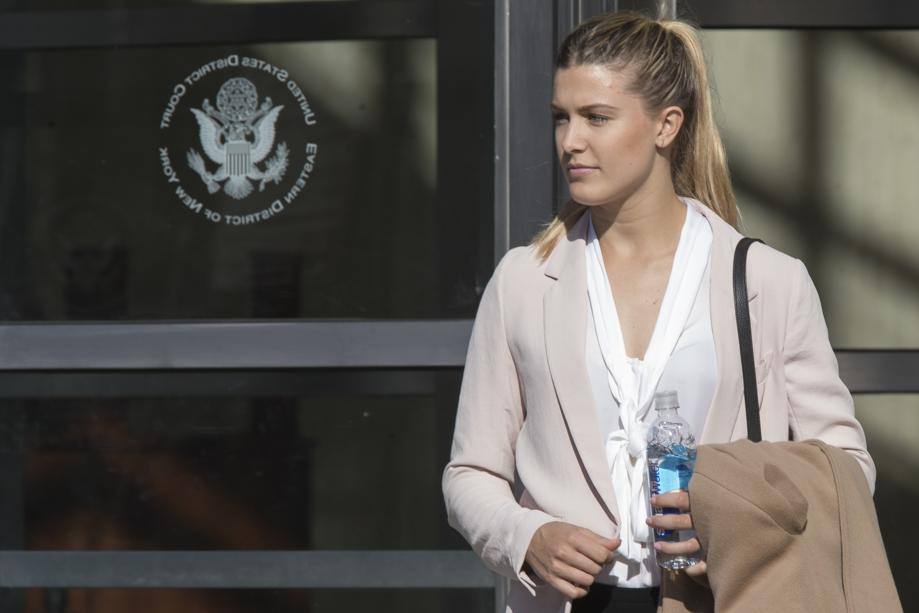 Tennis star Eugenie Bouchard leaves Brooklyn Federal court Wednesday Feb. 21 2018 in New York. Bouchard testified during her negligence lawsuit against the United States Tennis Association that a wet floor caused her to slip and fall inside a locker