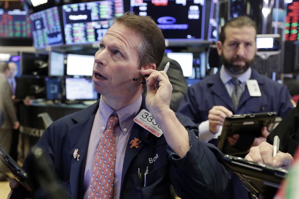 Trader Robert Charmak left works on the floor of the New York Stock Exchange Thursday Feb. 8 2018