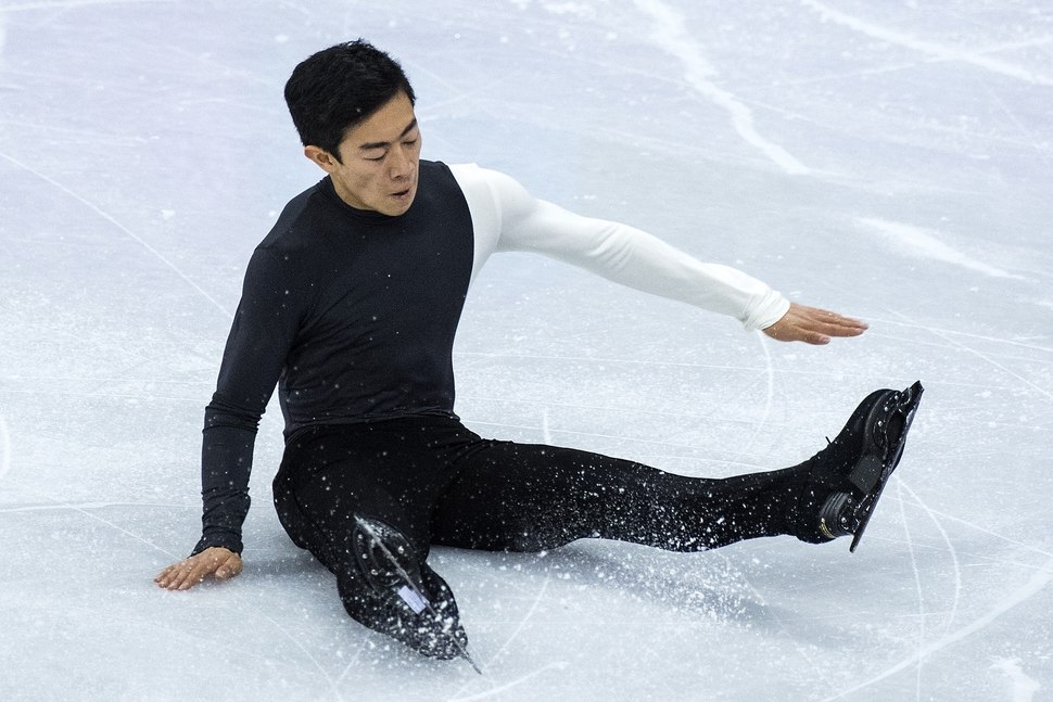 Salt Lake City's Nathan Chen falls while competing in the Men Single Skating Short Program at Gangneung Ice Arena during the Pyeongchang 2018 Winter Olympics Friday Feb. 16 2018. Chen finished with a score of 82.2