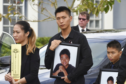 Peter along with his younger brother Alex after his brother's funeral at Kraeer Funeral Home in Coral Springs Fla. Peter Wang is a victim in the shooting at Marjory Stoneman Douglas High School