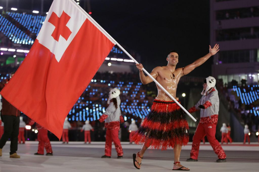 Pita Taufatofua carries the flag of Tonga during the opening ceremony of the 2018 Winter Olympics in Pyeongchang South Korea Friday Feb. 9 2018