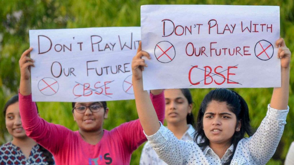 CBSE students display placards during a protest over the alleged paper leak in Jabalpur on Friday