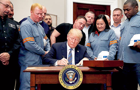 Donald Trump signs the proclamation in Washington on Thursday. Reuters