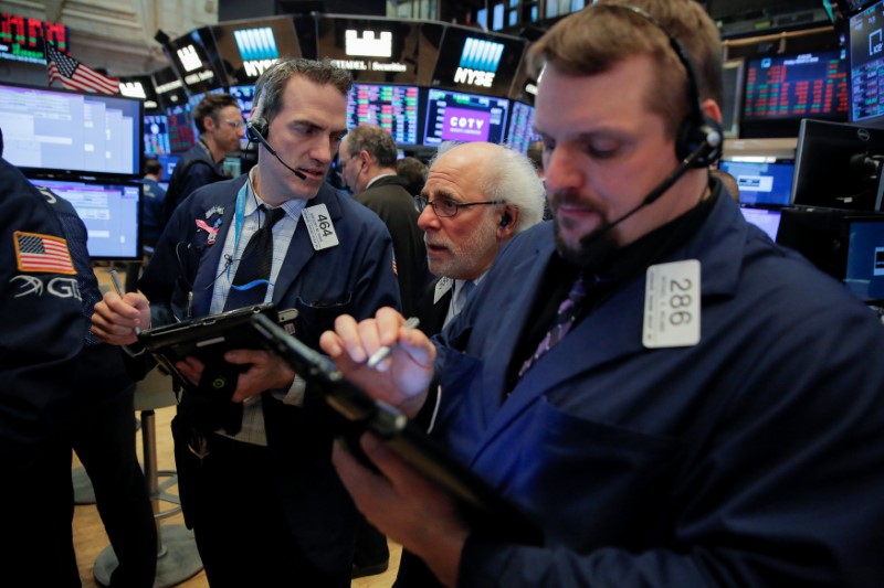 Traders work on the floor at the New York Stock Exchange in Manhattan New York