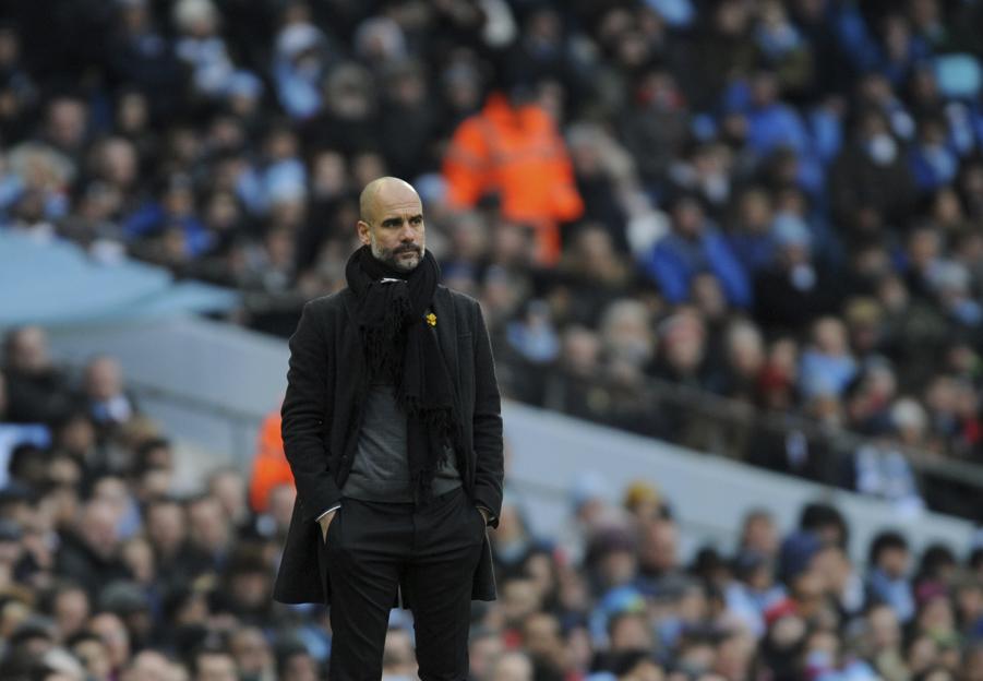 Manchester City manager Josep Guardiola looks during the English Premier League soccer match between Manchester City and Chelsea at the Etihad Stadium in Manchester England Sunday