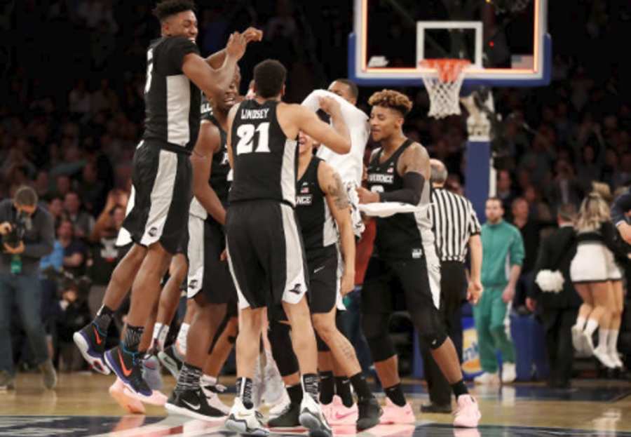 College hoops glance: Providence fends off Creighton in OT