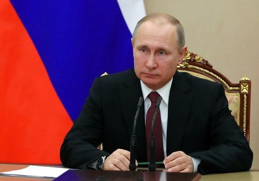 Russian President Vladimir Putin chairs a Security Council meeting in Moscow Russia. The State Department has notified Congress that it will not impose new sanctions on Russia at this time. The State Department says it is