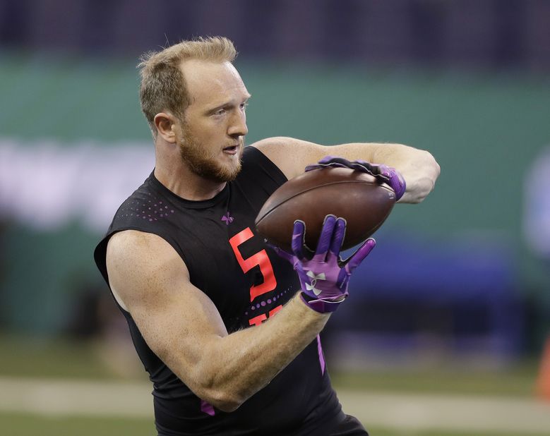 Washington tight end Will Dissly runs a drill during the NFL football scouting combine Saturday