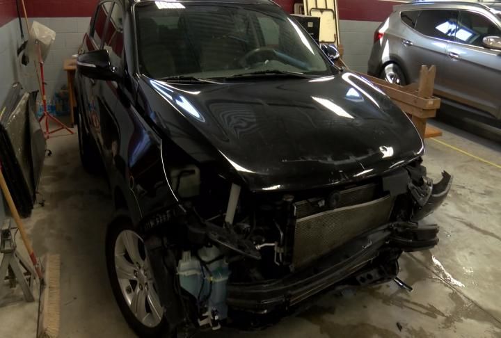 Damage to front end of a vehicle in the shop