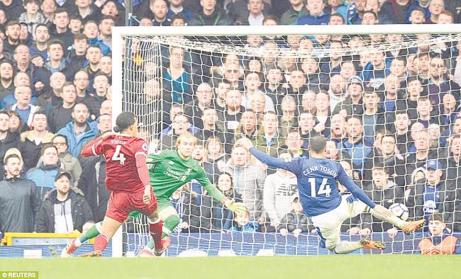 Everton’s Tosun misses a chance to score during the second half of the Premier league match against Liverpool on Saturday