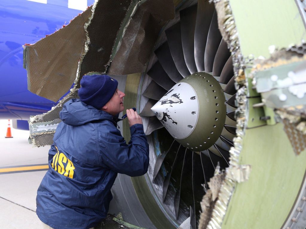 Inspector examines the damaged Southwest Airlines engine.   NTSB   Reuters