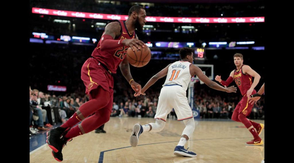 Cleveland Cavaliers forward Le Bron James drives the baseline against the New York Knicks during the first quarter of an NBA basketball game Monday