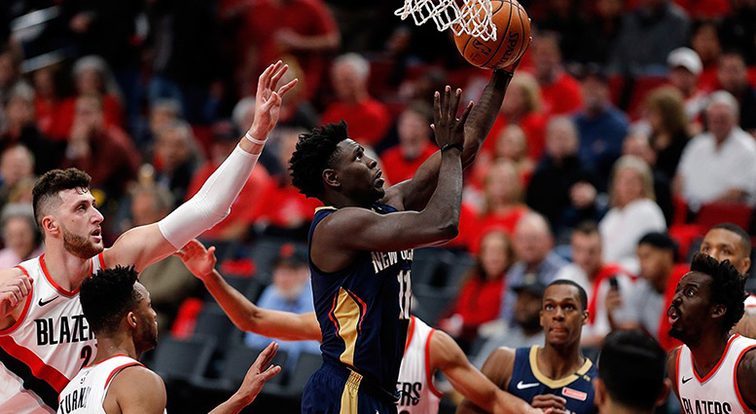 Normally mild-mannered Jrue Holiday shows emotion banters with fans dunks on Blazers in Game 2