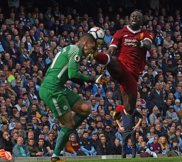 Sadio Mane challenges Ederson Moraes and gets sent off during the Premier League match between Manchester City and Liverpool at Etihad Stadium