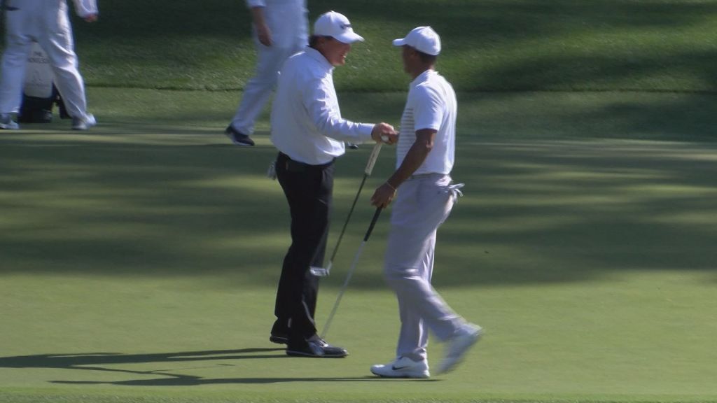 Tiger Woods embracing Phil Mickelson