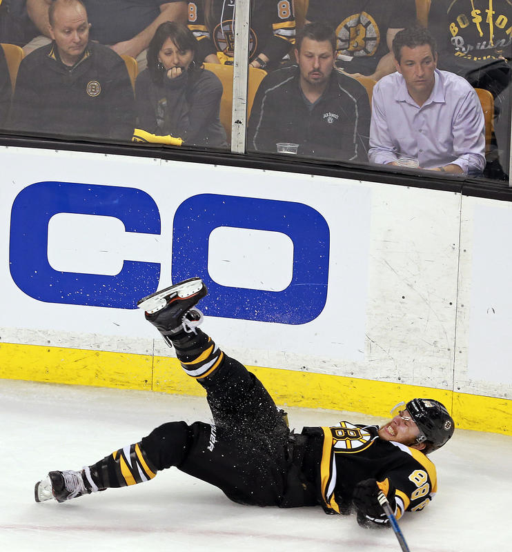 Boston Bruins right wing David Pastrnak goes down hard during the second period of Round Two Game Three of the Stanley Cup Playoffs against the Tampa Bay Lightning at the TD Garden on Wednesday