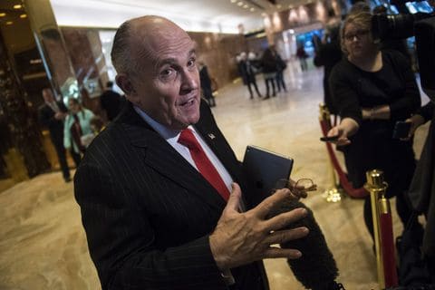 Rudolph W. Giuliani talks with reporters at Trump Tower in New York in January 2017